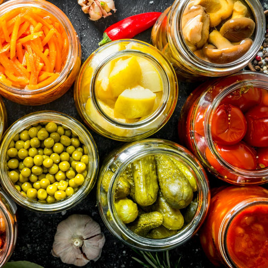 aerial view of several jars of pickled veggies