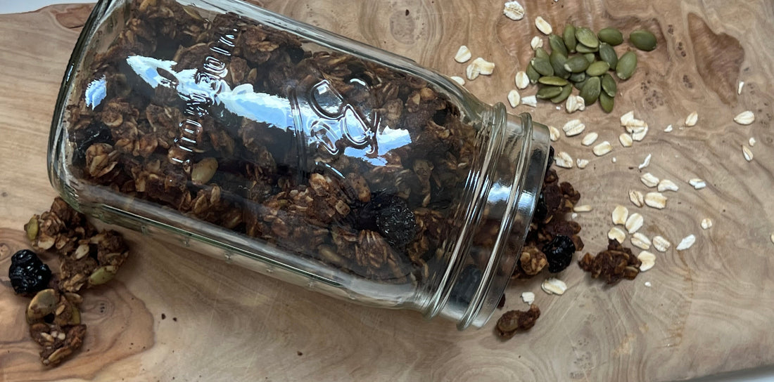 Granola in a jar on a cutting board 