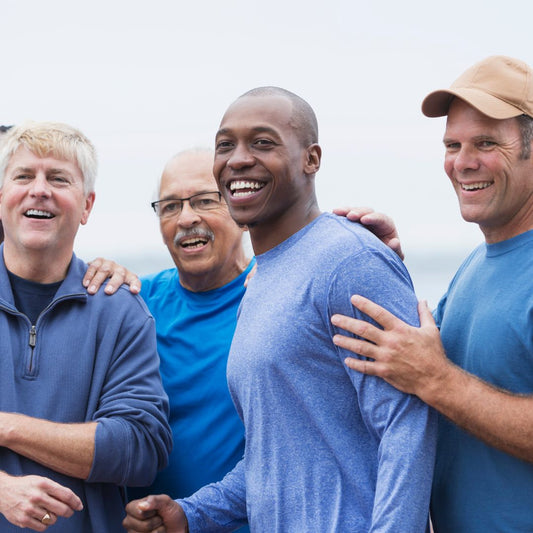 Group of 4 men smiling