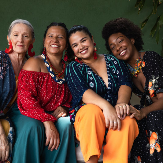 Group of women with hands in the center