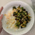 
          white bowl with white rice, cooked brussel sprouts and drizzle of sriracha mayo
        