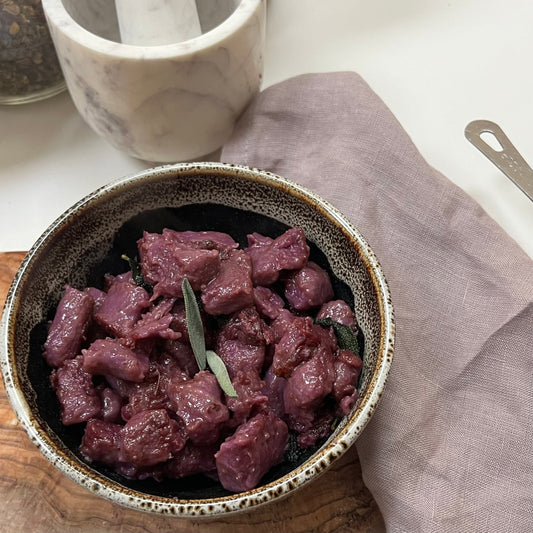 Cooked purple gnocchi in bowl 