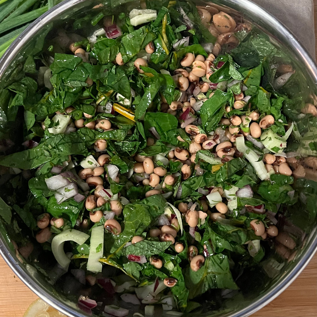 Top view of completed salad in a metal bowl 