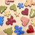 
                  various sugar cooking frosted with natural food color frosting. The cookies are shaped as stars, gingerbread men, candy canes, hearts and trees.
                