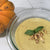 
                  clear bowl of cream colored pumpkin soup
                
