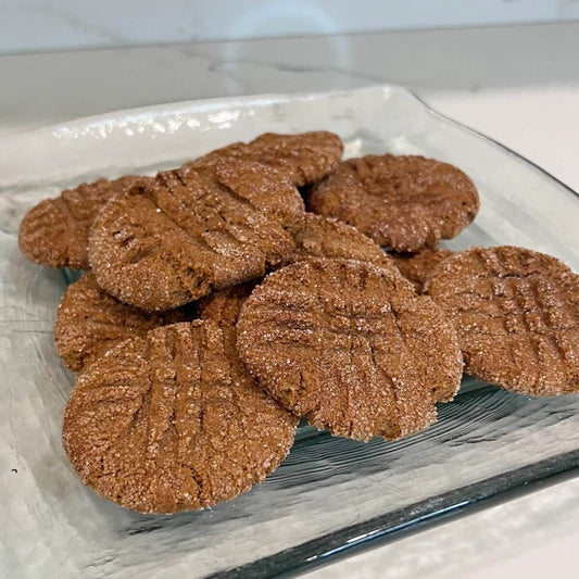 Plate of Vegan Gingersnap Cookies on a glass platter