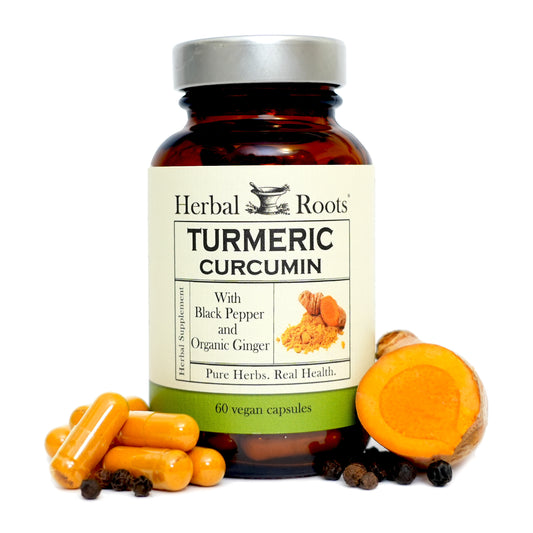 Herbal Roots bottle of Turmeric Curcumin supplement made with black pepper and ginger with fresh ingredients around.