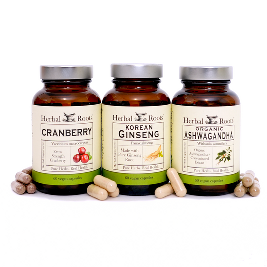 Bottle of Herbal Roots Cranberry, Korean Ginseng, and Organic Ashwagandha, with capsules in front of the bottles.